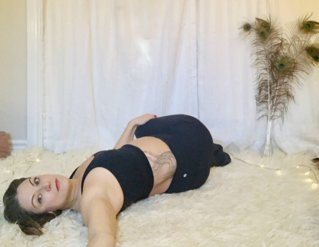 Supine Spinal Twist Yoga Pose (Supta Matsyendrasana) on shaggy carpet