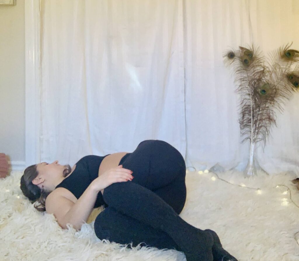 Supine Spinal Twist Yoga Pose (Supta Matsyendrasana) on shaggy carpet