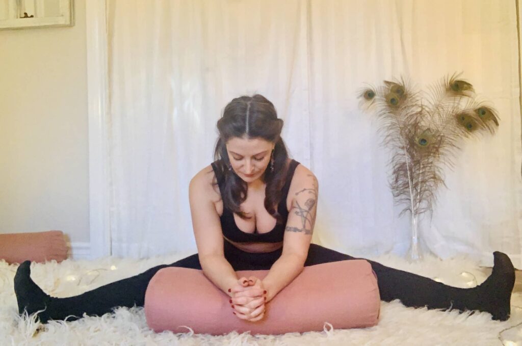 Wide-Angle Seated Forward Bend Yoga Pose - Upavistha Konasana on shaggy carpet